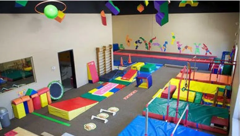 EGA’s separate tots gym with small bars, beams, soft blocks and a low trampoline